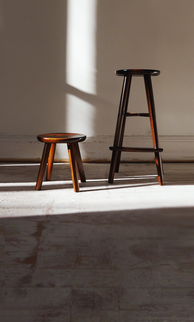Ibazen lacquered oak wood stool beside a bar stool