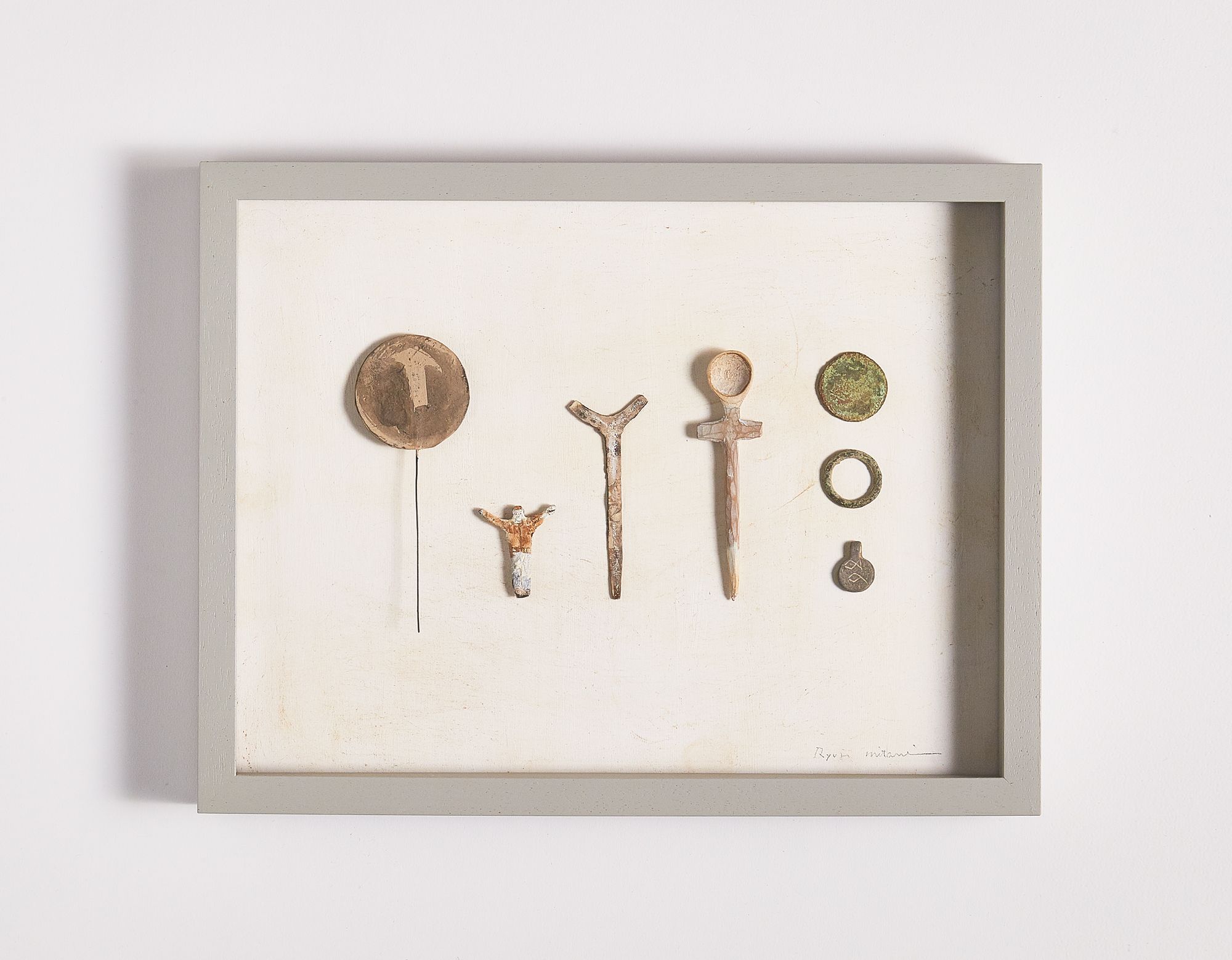Framed composition of found objects and made objects by Ryuji Mitani