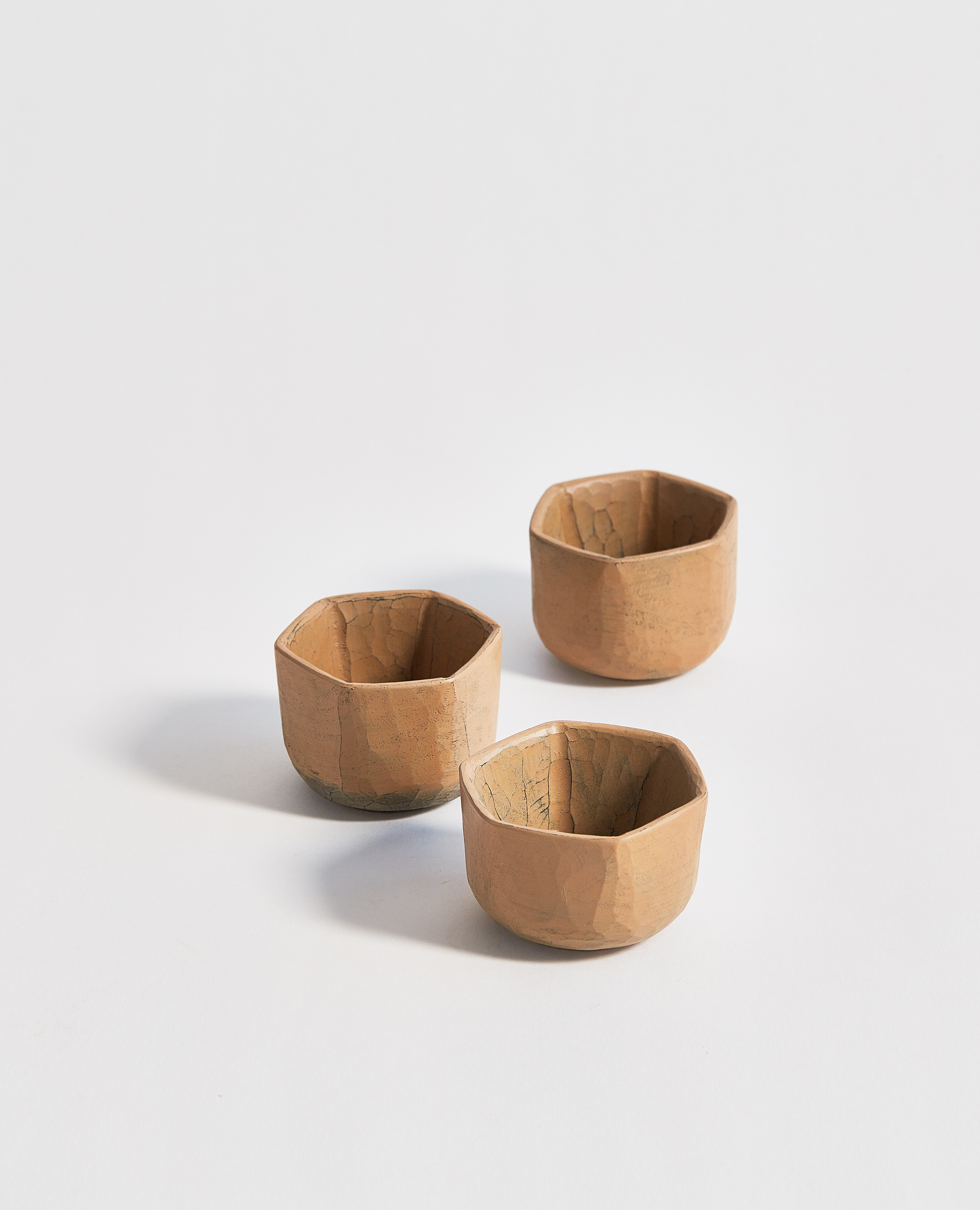 Three white urushi lacquered hexagonal wooden sake cups by Ryuji Mitani