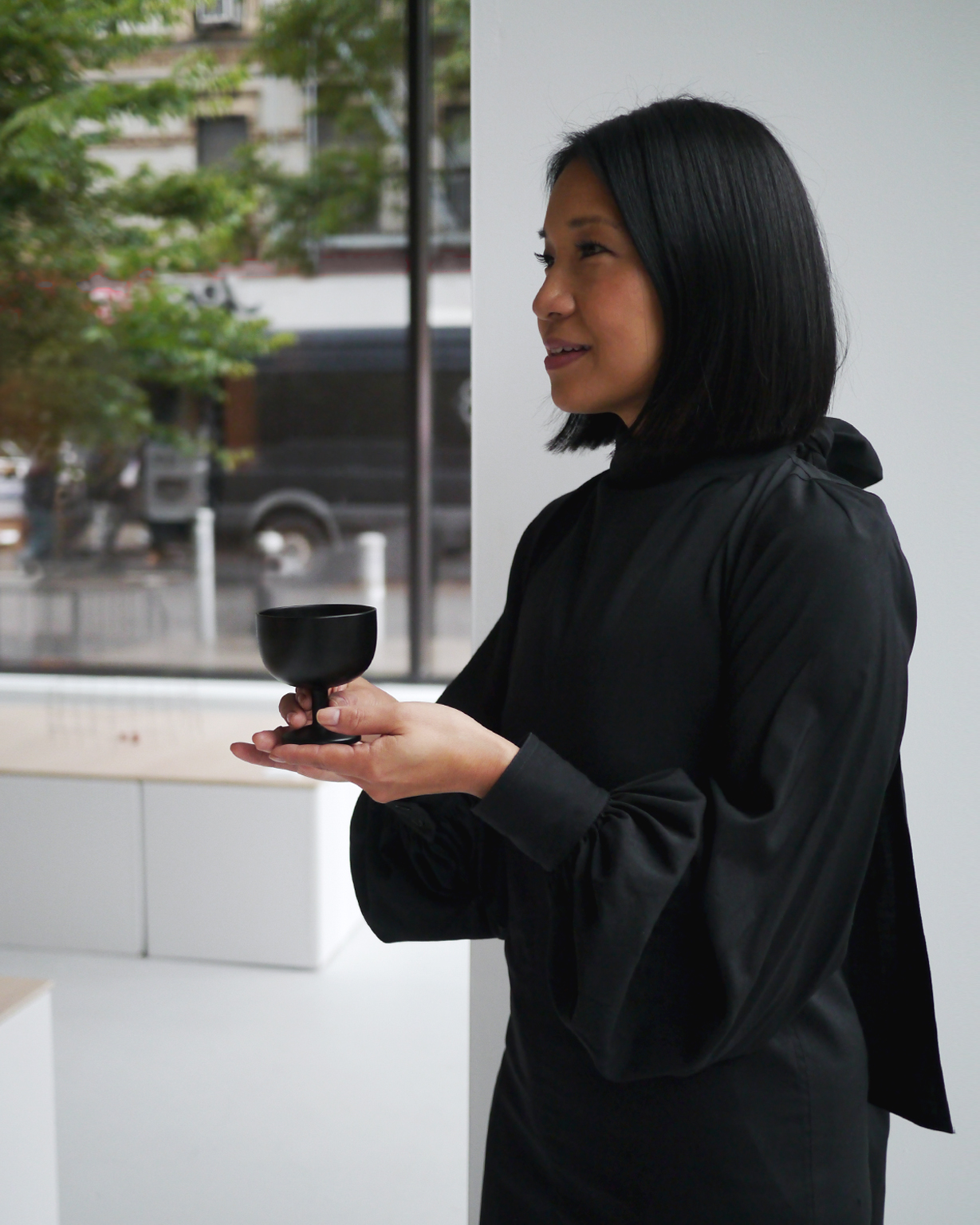 Architect Stephanie Goto with Noir Ice Cream Cup at Afterlife Ryuji Mitani exhibit at Nalata Nalata