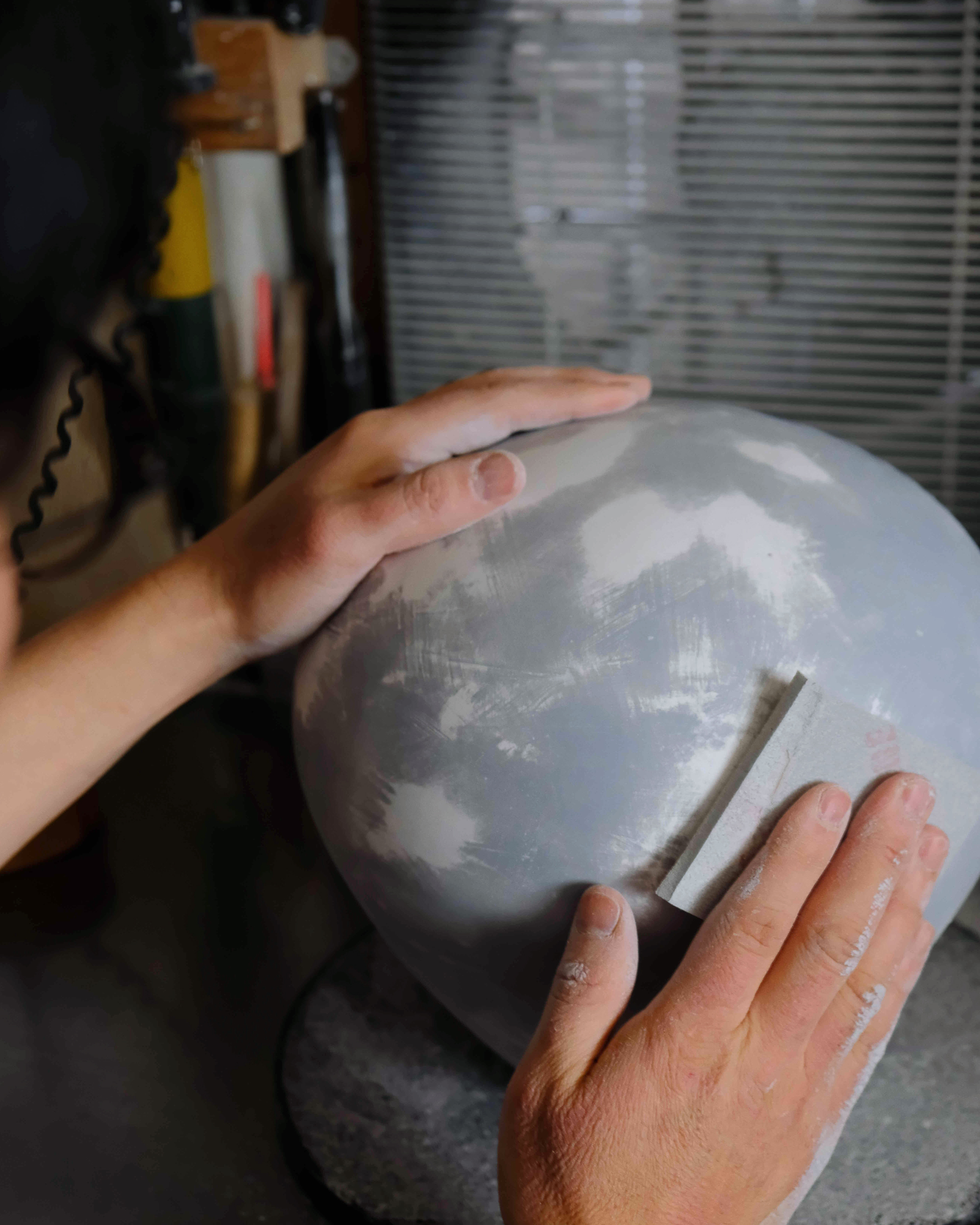 Hirotaka Tobimatsu adding finishing touches to the Baloon Table Lamp