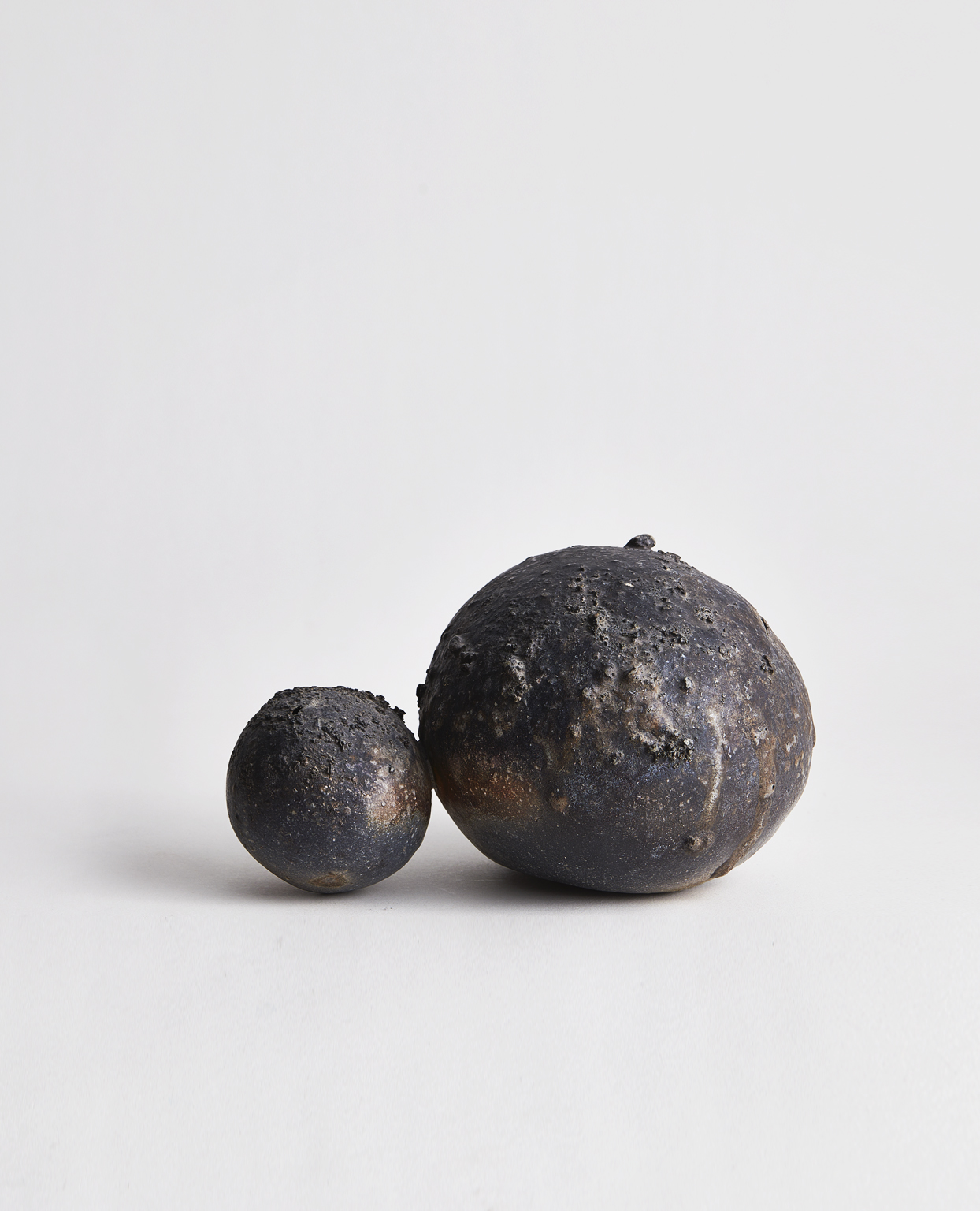 Anagama No.4 - Connected Spheres Sculptural Vase by Keisuke Iwata on a gray background