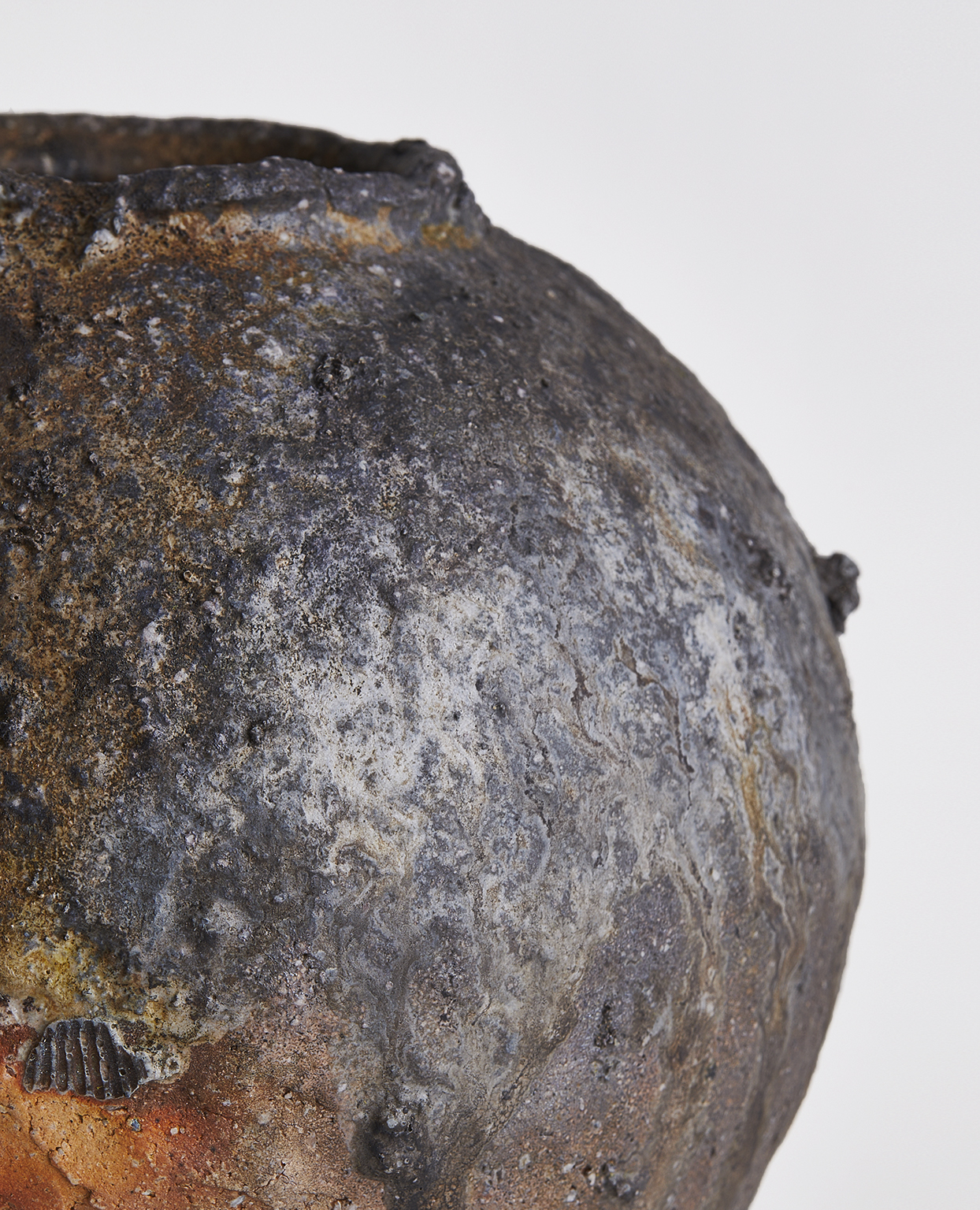 Up close, textural view of Anagama No. 2 - Large Heishi Vase by Keisuke Iwata on a gray background