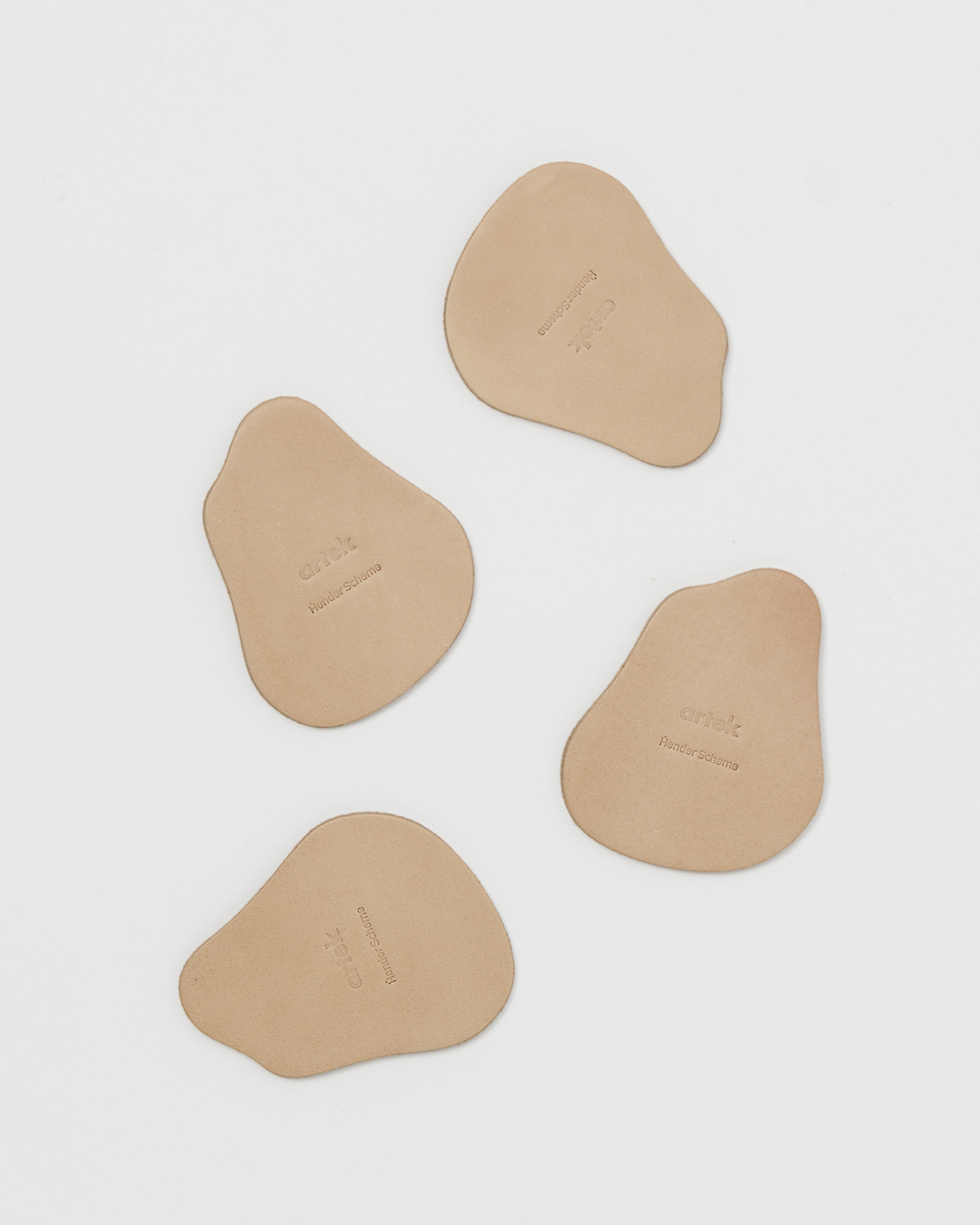 Coasters by Hender Scheme x Artek on a gray background
