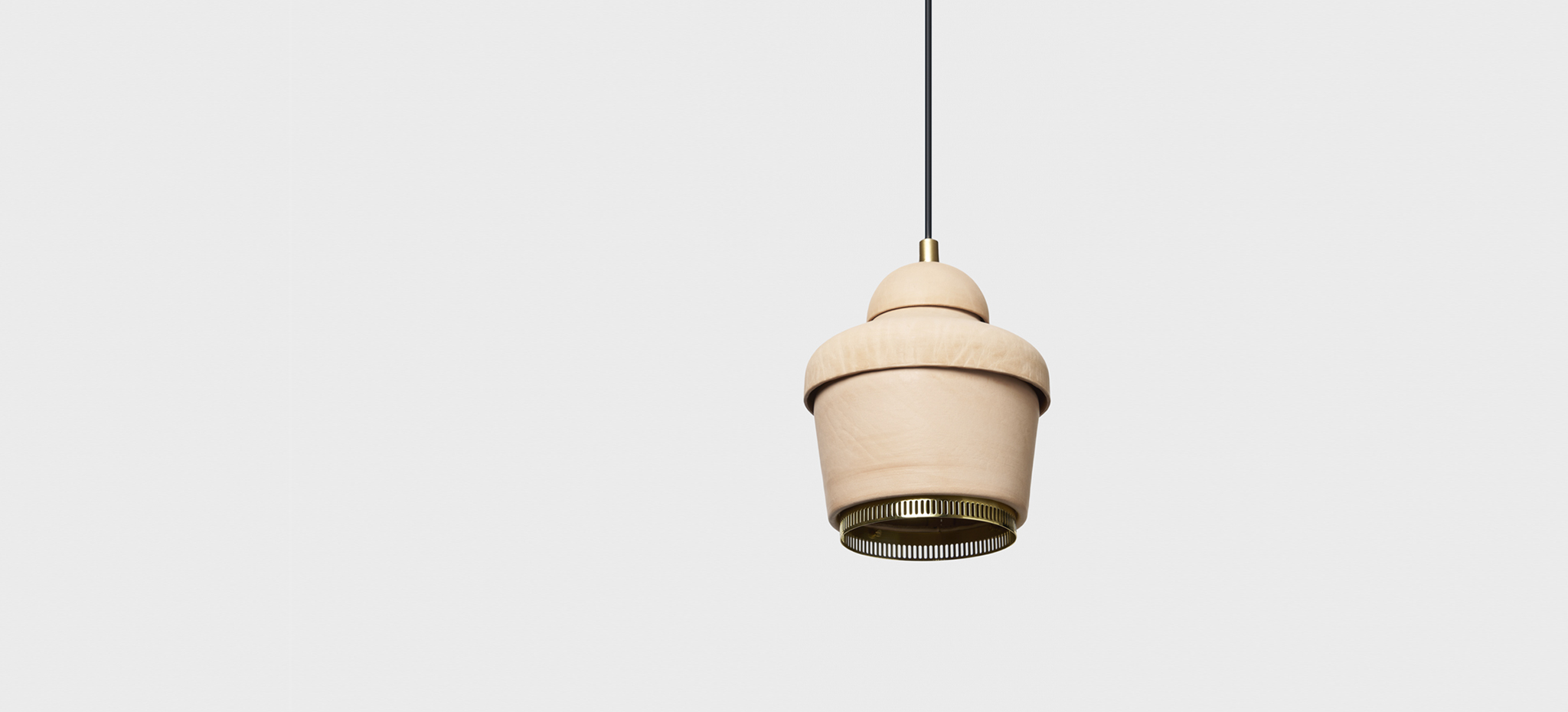 Light pendant by Hender Scheme x Artek on a gray background