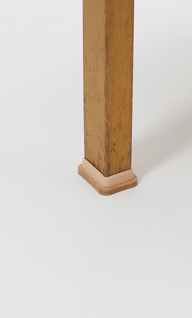 Hender Scheme and Artek Natural vegetan stool shoes against offwhite background